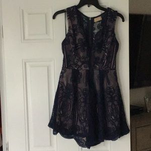 Sexy romper with navy lace overlay.